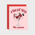 Martini Tipsy Santa Holiday Card, pink A2 card (4 1/4 x 5 1/2) with Santa lounging in a martini glass and festive text.