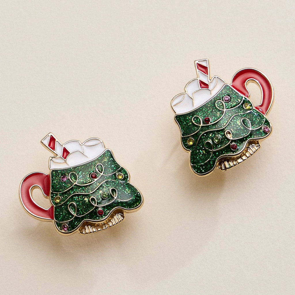 Pair of Christmas Tree Mug stud earrings with glittery green enamel, marshmallow topping, and candy cane accents.